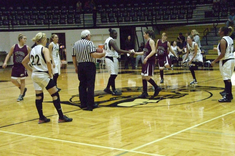 Image: Lady Gladiators Meet Lady Eagles — Jimesha Reed #40 shakes the hand of #25 Horn.  They are ready for competition.