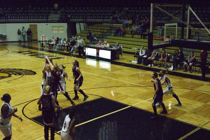 Image: Richards Battles — Megan Richards works hard to pass the ball into enemy territory.