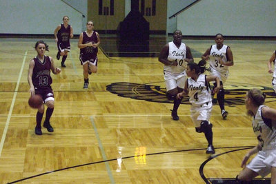 Image: Lady Eagle Struggles To Keep Ball — #13 Ridge works at keeping the ball from the Lady Gladiators.