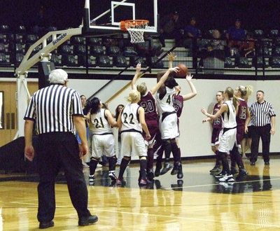 Image: Jimesha Reed — #40 Jimesha Reed struggles under the basket.