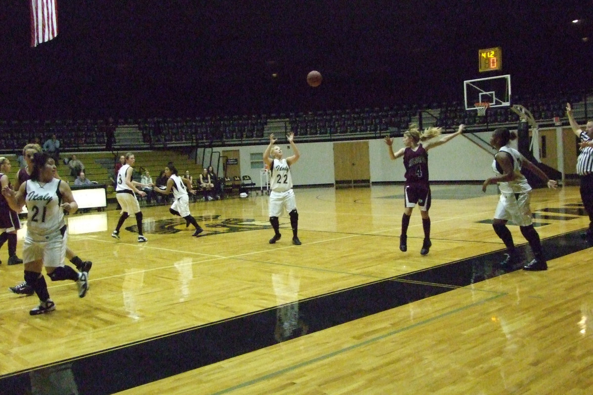 Image: Team Work — Shay Fleming throws the ball to Megan Richards.