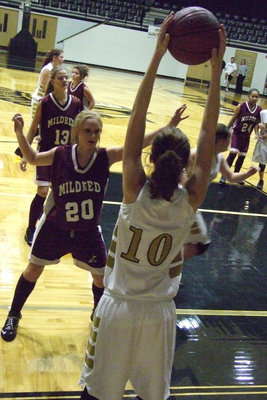 Image: Melissa Smithey — Smithey searches to throw the ball in on JV.