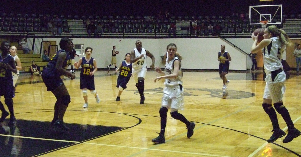 Image: DeMoss is ready — Becca grabs the ball and goes in for the kill.