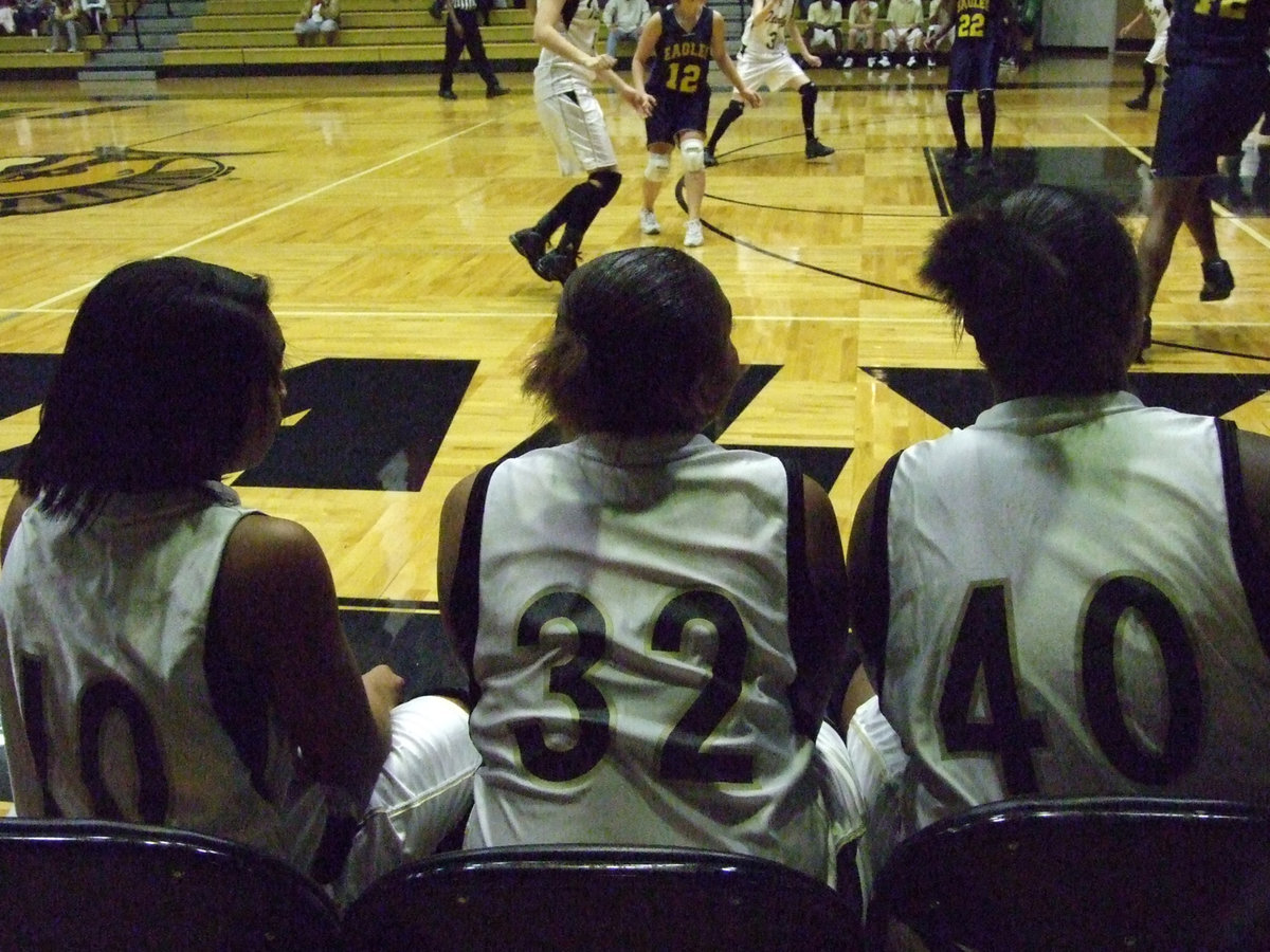 Image: Birdsong, Fleming, Reed — These Lady Gladiators took a minute and watched their teammates score against the Lady Eagles.