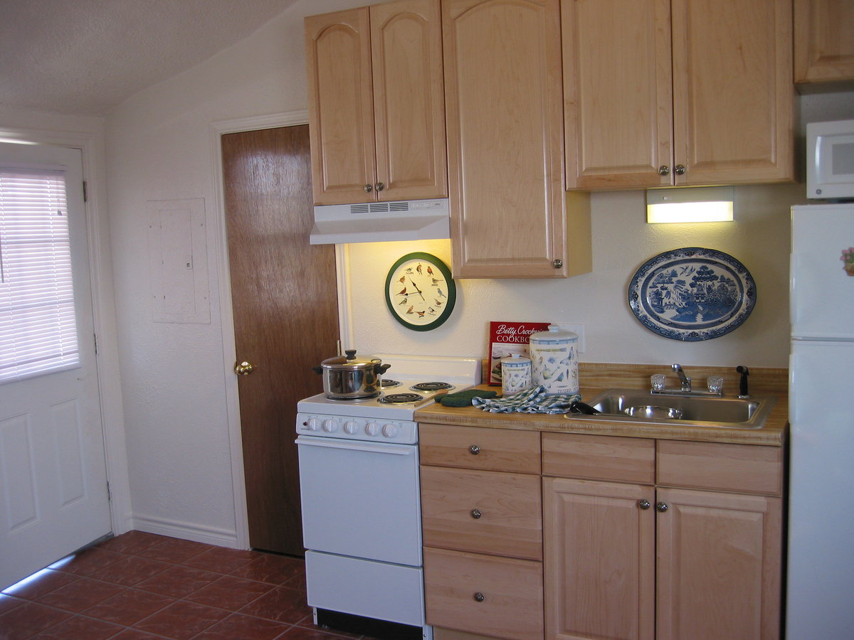 Image: Functional kitchen — The kitchen area has plenty of cabinet space.