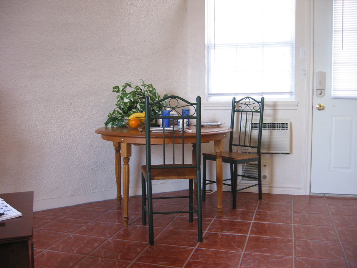 Image: Dining area — The studios are embellished with ceramic tile floors.