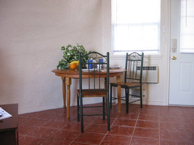 Image: Dining area — The studios are embellished with ceramic tile floors.