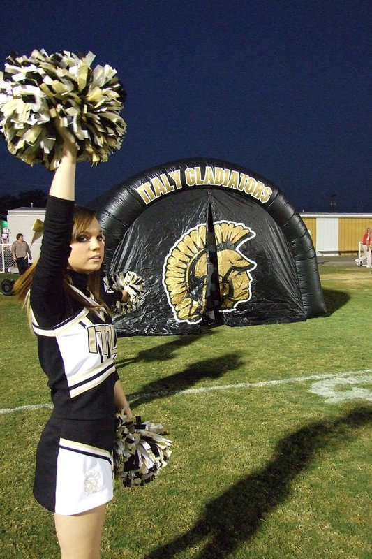 Image: Windham awaits team entrance — Cheerleader Drew Windham waits for the Gladiators to come through the tunnel.