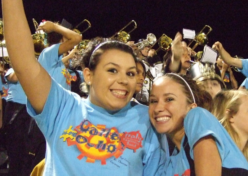 Image: Molly and Tess — Molly Haight and Tess Clark have fun in the stands with the band.