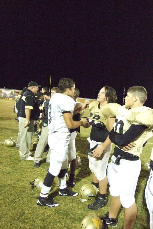 Image: Italy Congratulates Itasca — Italy’s Zach Hernandez congratulates #13 Greg Mason of Itasca’s team.  The Wampus Cats are undefeated and going to playoffs.