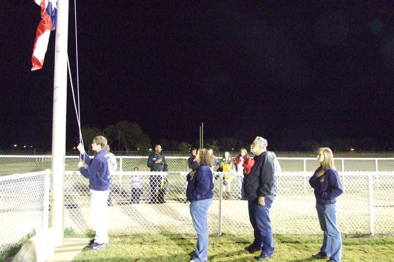 Image: Veterans Honored — The FFA and Veteran Ronnie Compton raise the colors before the game.  Mr. Compton graduated from IHS in 1968 where he played for the Gladiators.  He served in Vietnam from 1969-1970 with United States Marine Corp.  David Henderson, Jr. graduated from IHS in 1967 also played for the Gladiators.  After serving in Vietnam for only 30 days, he was killed in the Quang Nam Province in Vietnam in the line of duty on Nov. 4, 1968 at the age of 20.