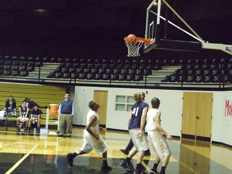 Image: Colton scores — Colton Campbell #5 lays it in as Deandre Sephus #3 follows it in.