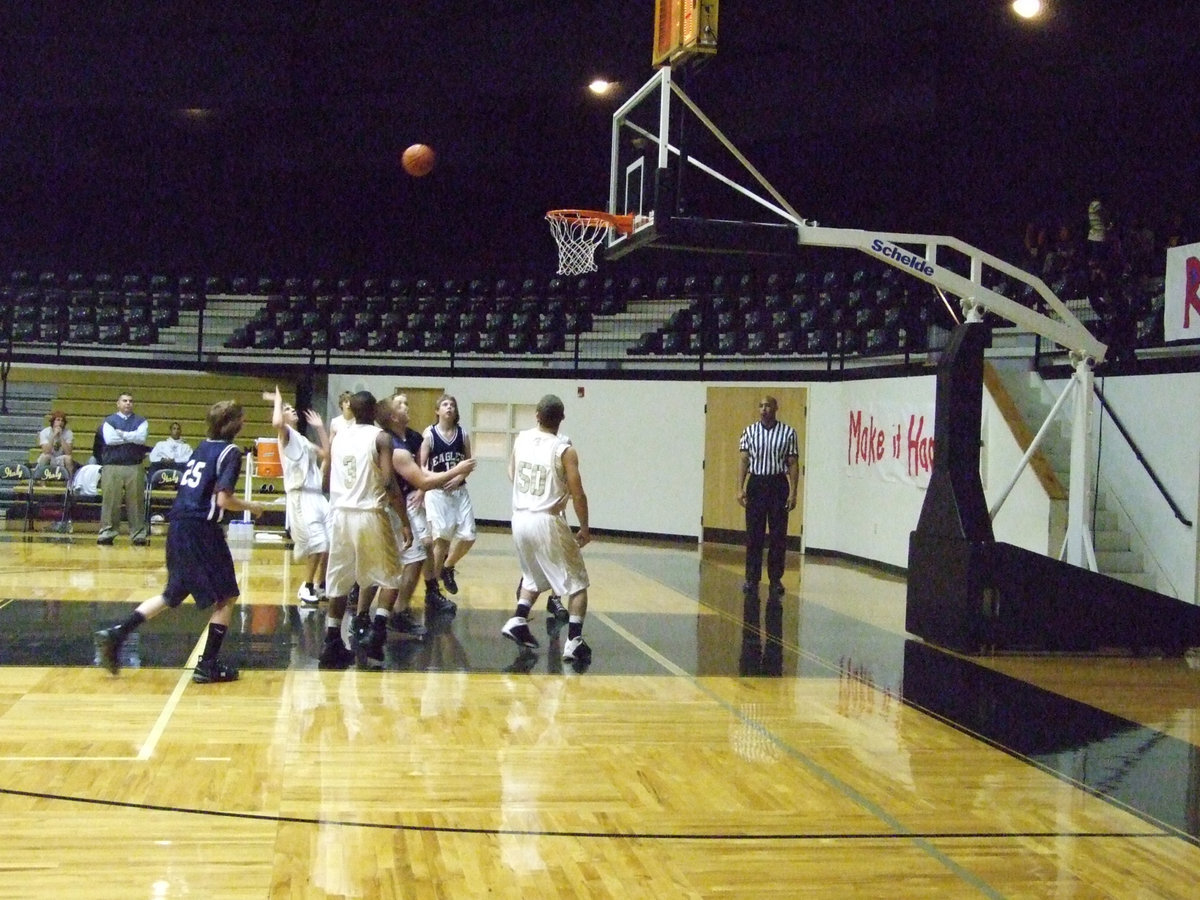 Image: Jase flips it up — Jase flips a shot up and over the Eagle defense.