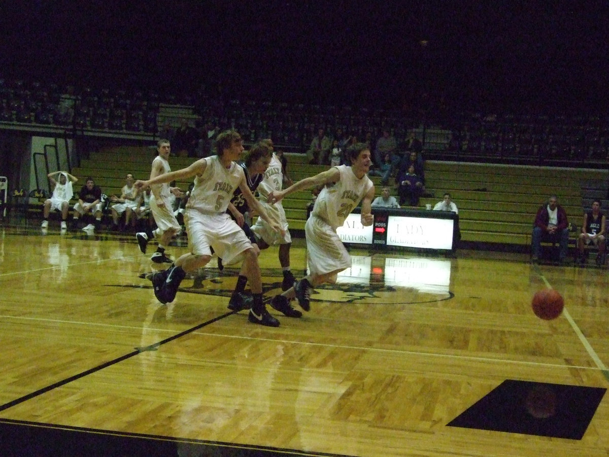 Image: Calf scramble — Colton and Ryan give their calves a nice stretch while going after the ball.