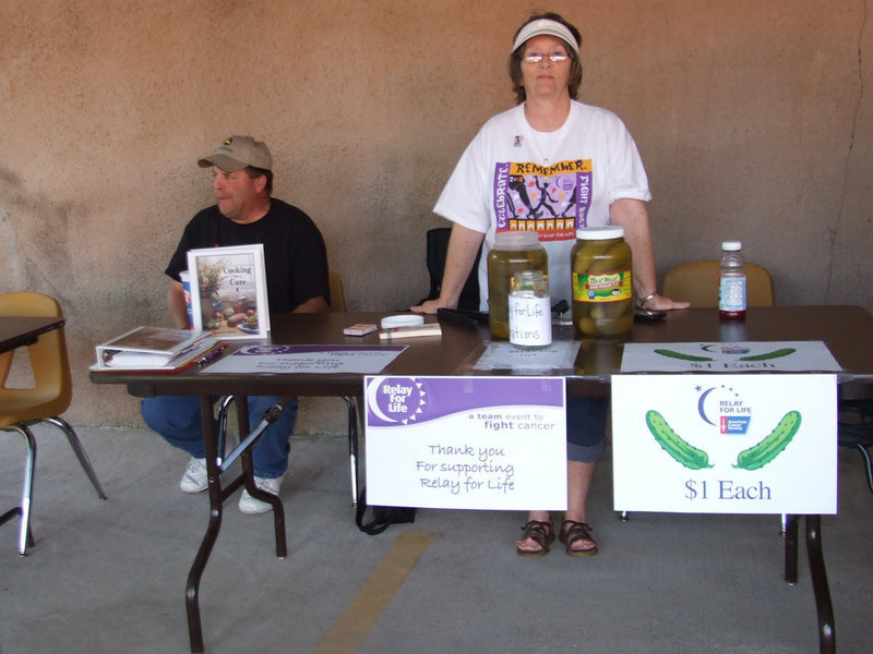 Image: Pickle booth — This booth was selling pickles and cookbooks for Relay for Life. Karen Mathiowetz and her husband Brian.