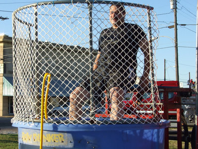 Image: Dunking booth — Police Chief Carlos Phoenix being a good sport manning the dunking booth.