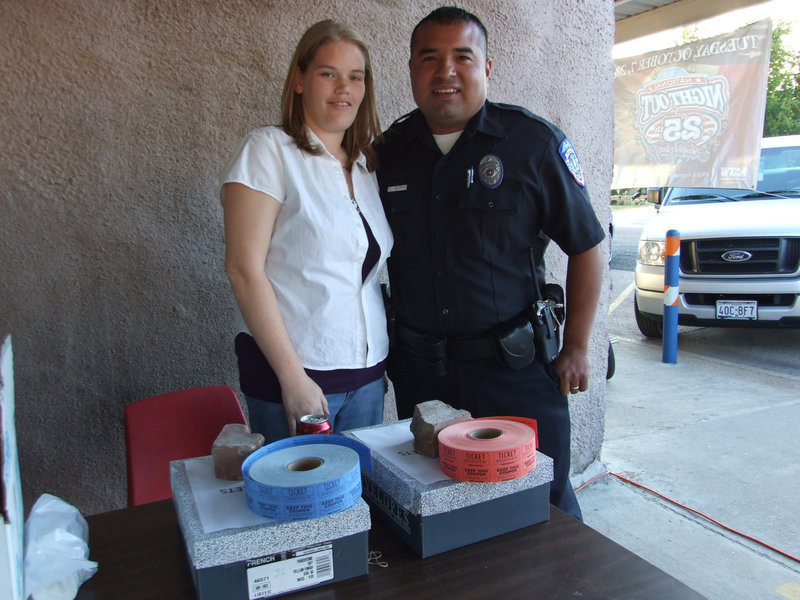 Image: Milford Police — Mannie Valdez and his wife, Casey, giving out free tickets for all to win prizes.
