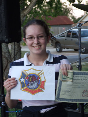 Image: Cheyenne Frank — Cheyenne Frank received $50 and a certificate for creating the new Milford firemen’s patch for their uniforms.