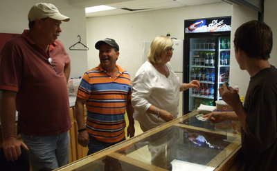 Image: 3 Musketeers — Tommy Morrison, Larry Eubank and Kathy Haight make a good team in the concession stand.