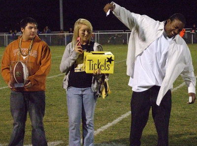 Image: Keith draws a ticket — The Class of 2012 gave away a football with 27 Cowboys signatures.