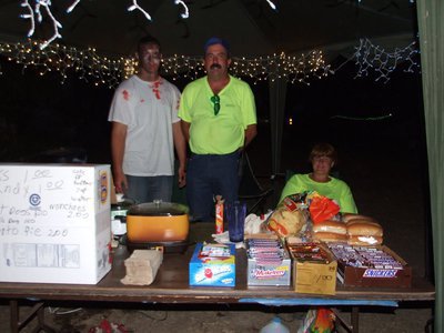 Image: Concession stand — Keith and Margaret Helms with a monster by their side invite you to eat.