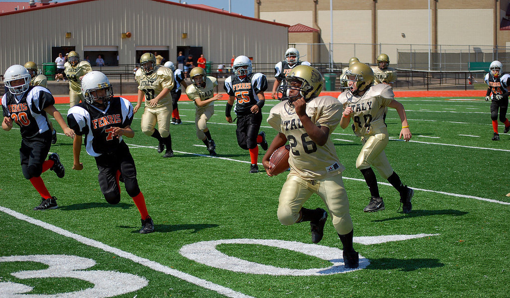 Image: Ken Norwood Jr. — Ken Norwood Jr. runs the ball for the A team.