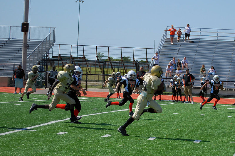 Image: Run for the score — Travion Zoll scores for the A Team.