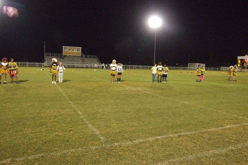 Image: Escorts and Honorees — Each honoree was escorted to the field as they were introduced.