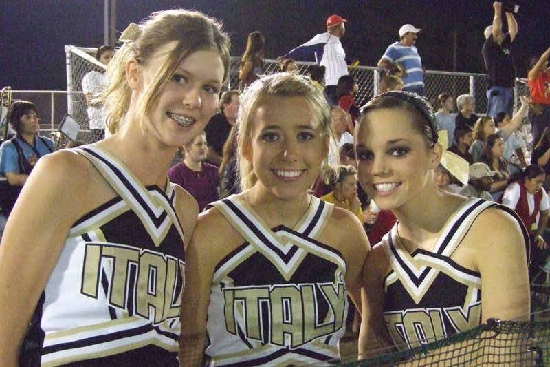 Image: IHS Cheerleaders — Kaitlyn Rossa, Lexi Miller, Drew Windham Cheesing for the camera.