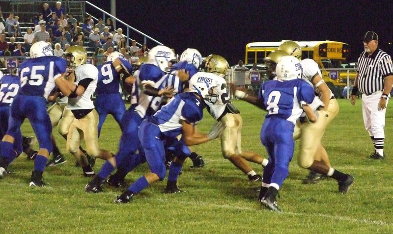 Image: Italy and Frost collide — Italy and Frost meet at the line of scrimmage.