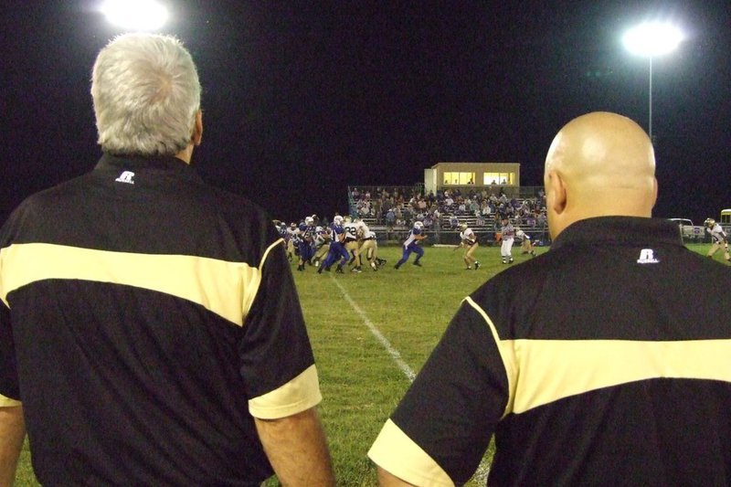 Image: Coaches watch the game — From Coach Coleman and Bales perspective.