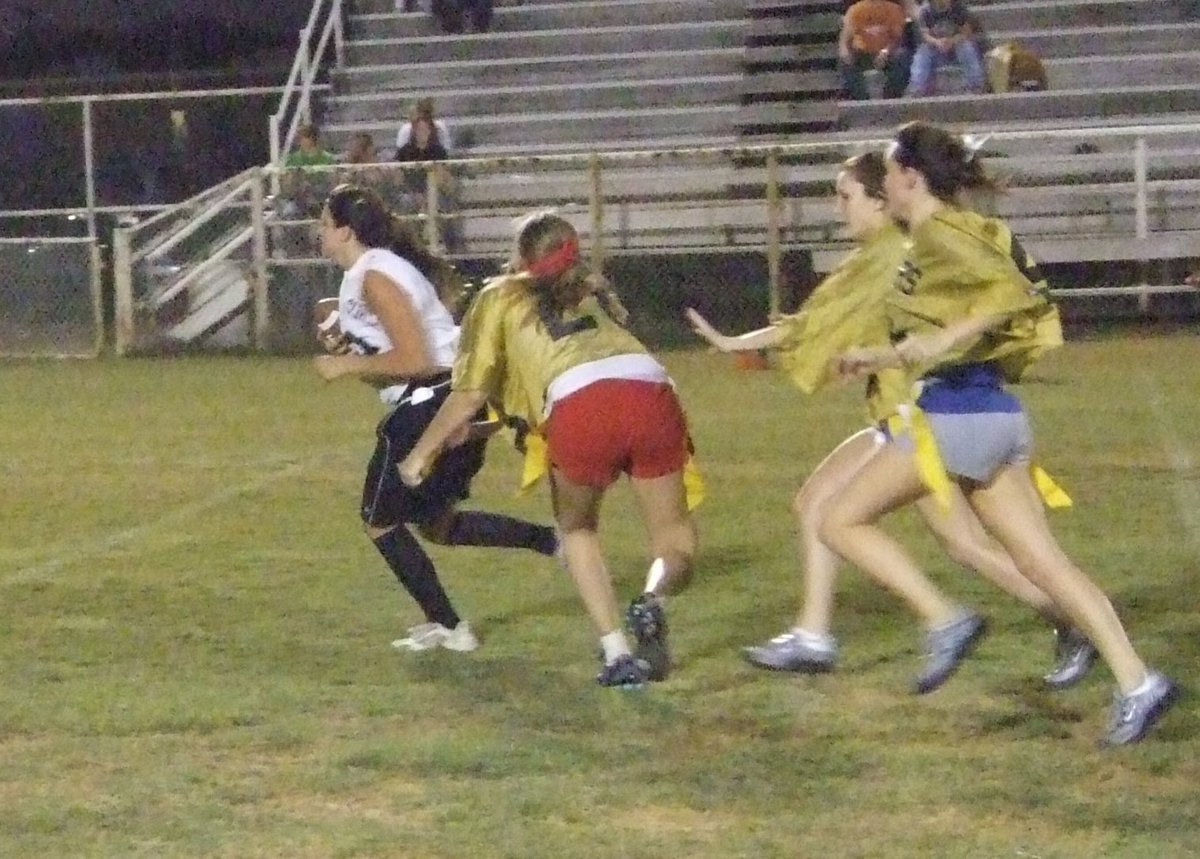 Image: Jeffords Loses Her Flag — Senior, Becca DeMoss stops Jeffords by pulling her flag.