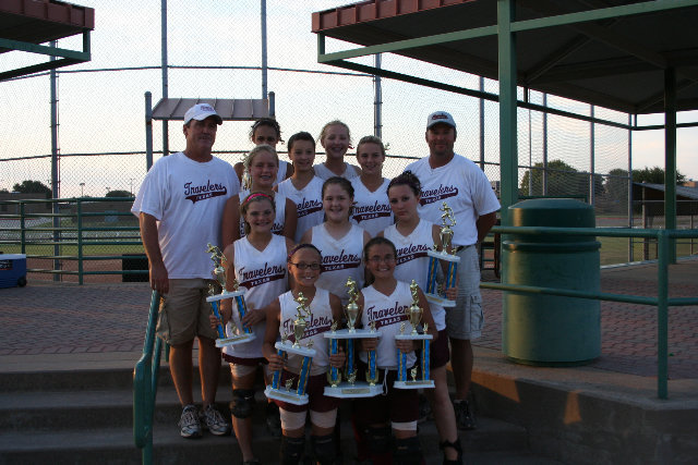 Image: Taking home the trophy — The Travelers, Ellis County 12-and-under softball team pose with the Garland Fall Invitational trophy. Competing against 16 other teams from around the state of Texas — mainly around the Metroplex — these young ladies won first place.