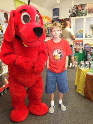 Image: Clifford and Michael Hughes. — Clifford the Big Red Dog and Michael Hughes getting ready to go book hunting.
