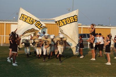 Image: Tearing onto the field — Italy 8th grade busts out the banner!