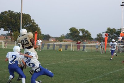 Image: Going for the catch — #25-Tyvion Copeland attempts to catch the ball.