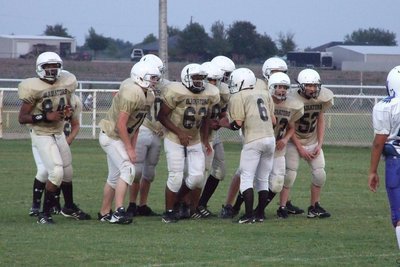Image: In the huddle — 8th Grade huddles up for the play.