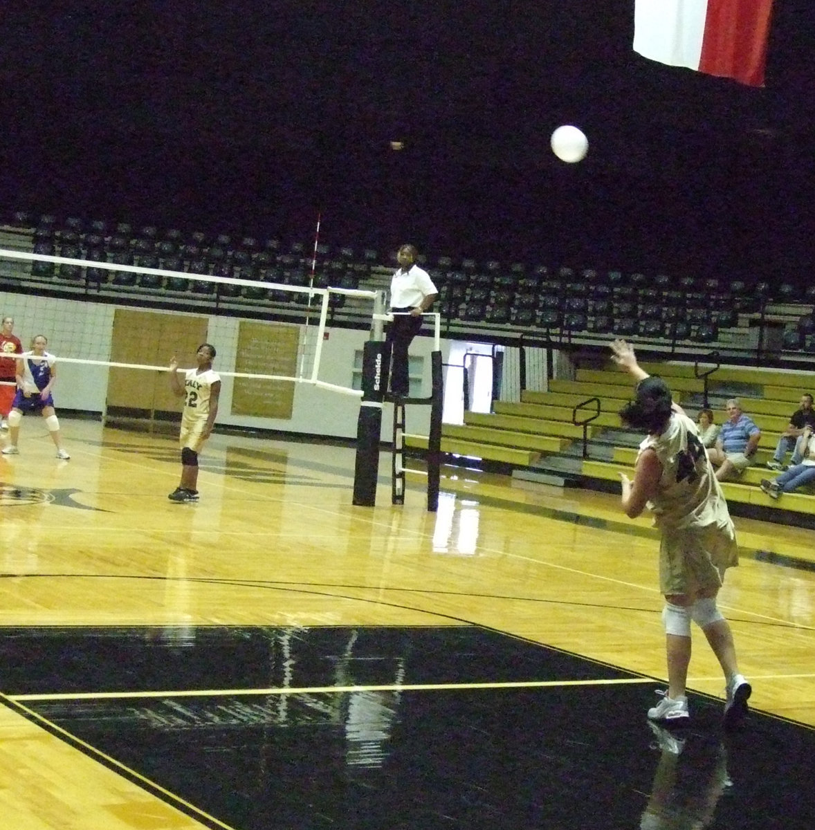 Image: Paige serves up a tough one — #44 Paige Westbrook takes control of the serve.