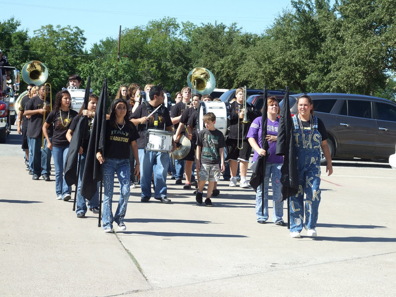 Image: IHS Regiment Band — The Italy Flag Corp leads the way for the band.