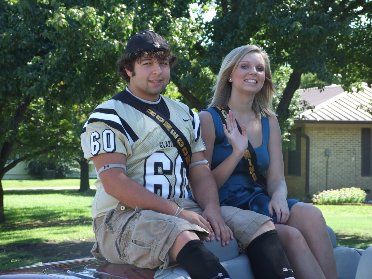 Image: Ivan and Meagan — Ivan Roldan and Meagan Hopkins wave hello.