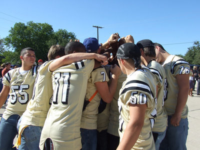Image: Huddle up — The Varsity players huddle during the pep rally.