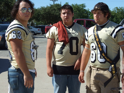 Image: Ready for battle — Zach Hernandez, Isaac Medrano and Ivan Roldan at the pep rally.