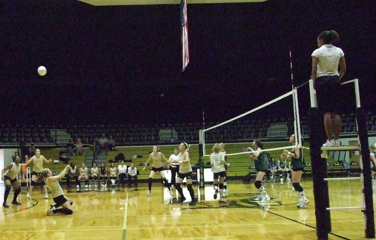 Image: JV starts things off — A Lady Gladiator goes to her knees to get under a hit from the Lady Cats. The JV teams for Italy and Blum were first to play.