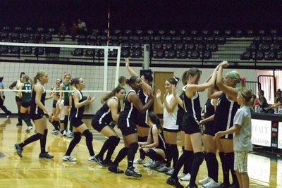 Image: Getting pumped up — The Lady Gladiators get ready to play against the Lady Cats from Blum.
