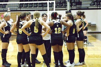 Image: Lady Gladiators huddle — Coach Windham talks to the Lady Gladiators in time out.