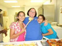 Image: Fun in the kitchen — Elizabeth Garza, Winona Crumpton and Taylor Garza having fun serving all their customers.