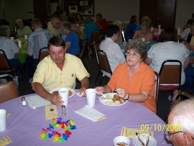 Image: Eubank and Lawson eating —  Larry Eubank, school board president and Diane Lawson, retired school administrator.