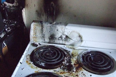 Image: Fire damage on stove — The damage in the dome only extended to the kitchen.  Everything else was only sooty.
