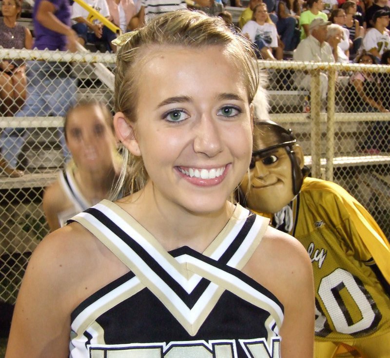Image: Palmer vs Italy — Varsity Cheerleader, Lexi Miller, takes time for a smile.