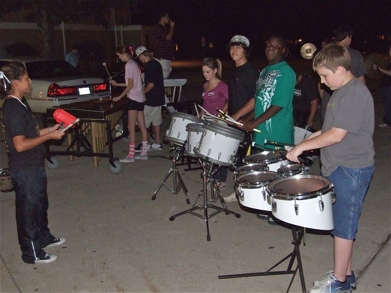 Image: The Gladiator Regiment Band pounds the pavement — The Gladiator Regiment Band rehearses their marching routine they’ll be performing at halftime during the Friday night football game in Malakoff.